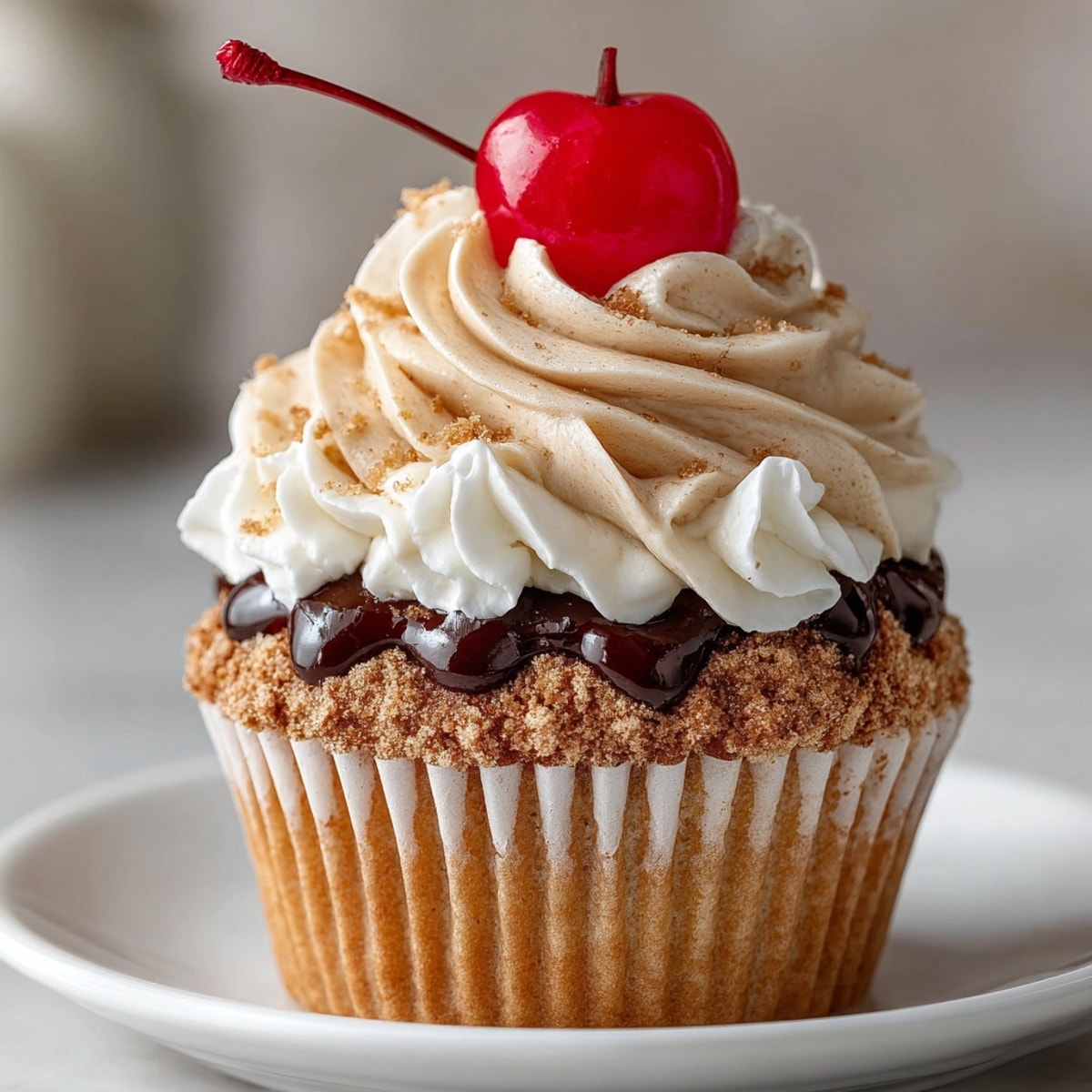 Root Beer Float Cupcakes topped with creamy swirl frosting, ready for a sweet American treat.