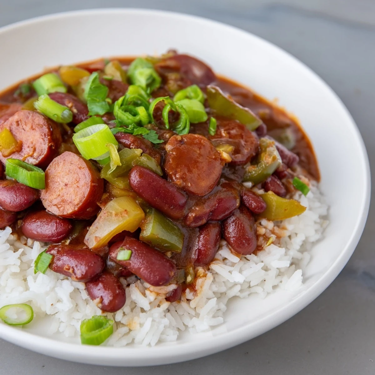 Close-up of creamy, flavorful Red Beans & Rice served with fluffy white rice, ready to eat.