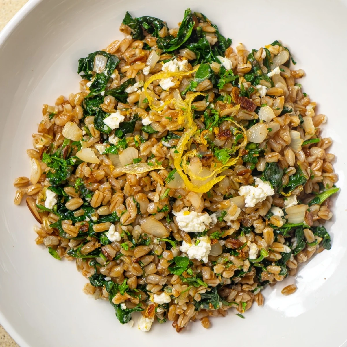 Savory Warm Farro & Greens Pilaf with fresh parsley, ready as a light lunch or dinner.