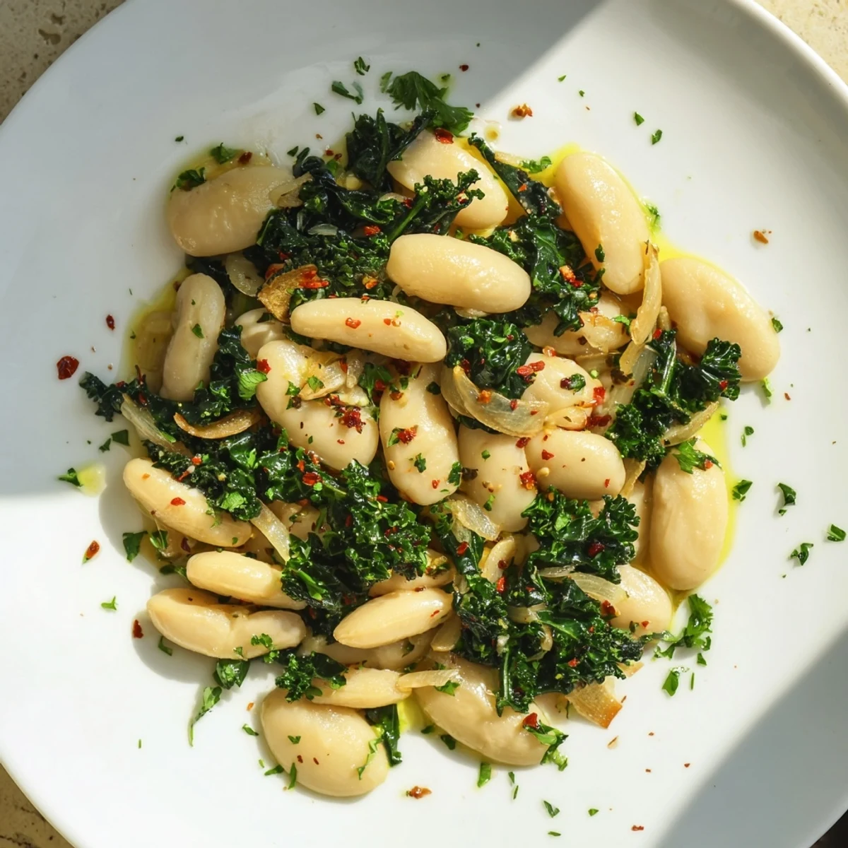 Close-up of Garlicky Beans with Winter Greens: showcasing tender greens and the fragrant garlic infused beans.