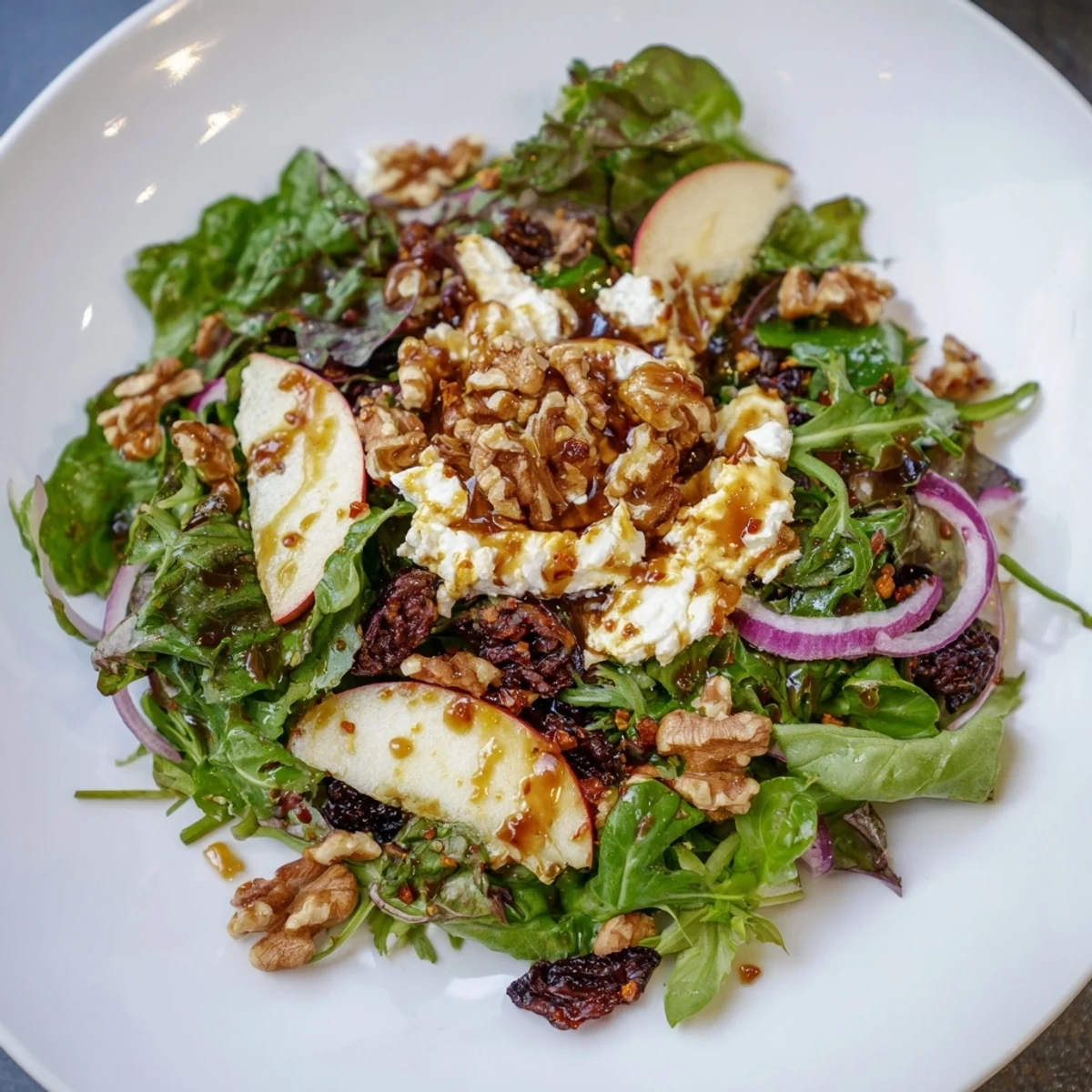 Imagine the flavors! This gorgeous Spiced Honey and Date Goat Cheese Salad displays a delicious Mediterranean dish.