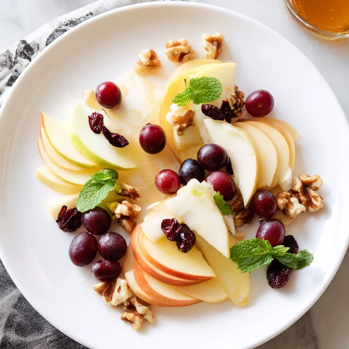 A beautiful Apple Orchard Fruit Board: featuring vibrant apples, pears, and sweet honey for dipping.