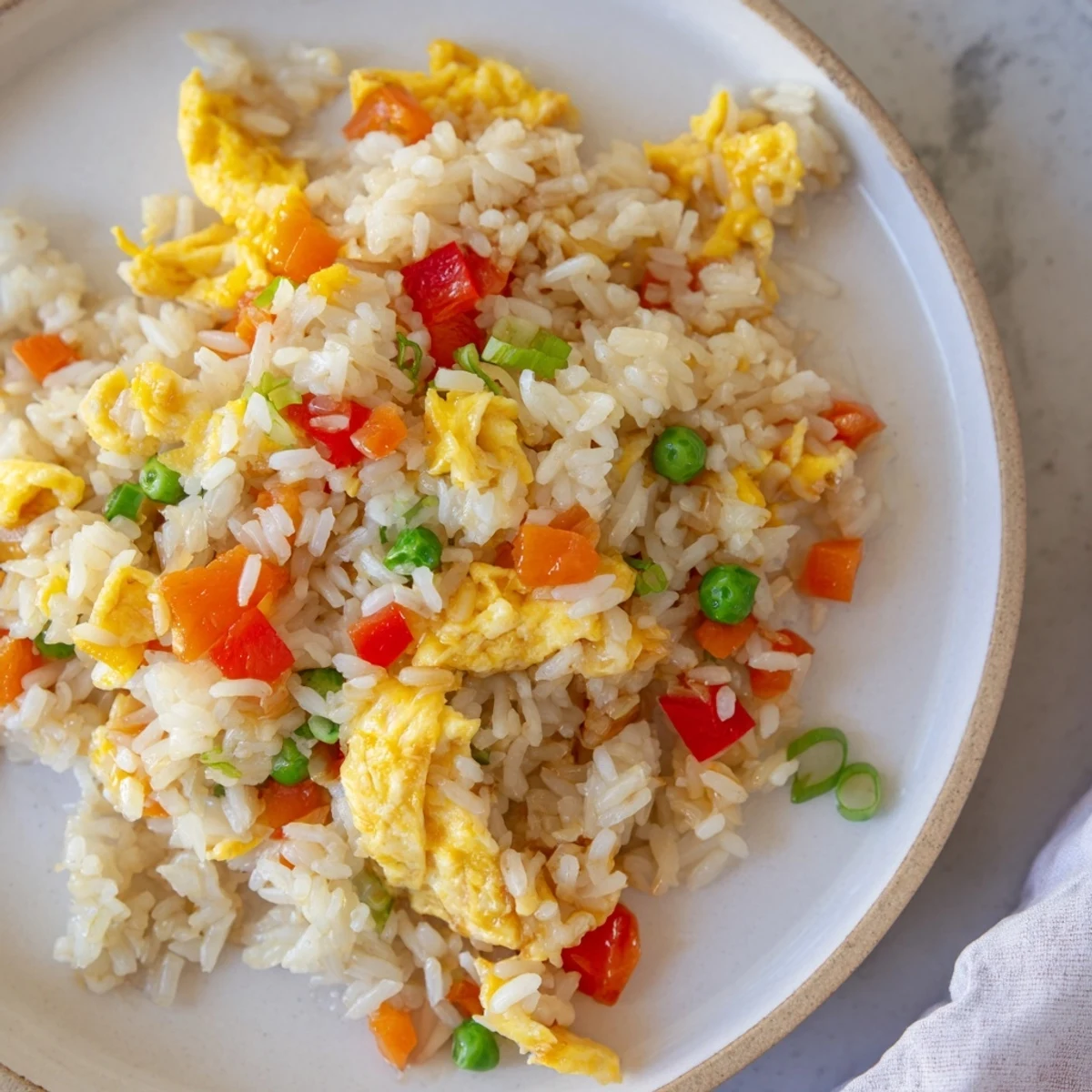 Golden, savory egg fried rice classic, a quick and easy homemade Chinese-inspired stir-fry.
