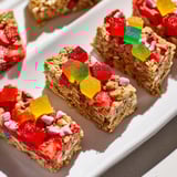 Homemade gummies top delightful oat base, creating vibrant DIY snack bars.  