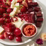 This striking image showcases The Nutcracker Suite Board, overflowing with colorful charcuterie elements that appeal.  