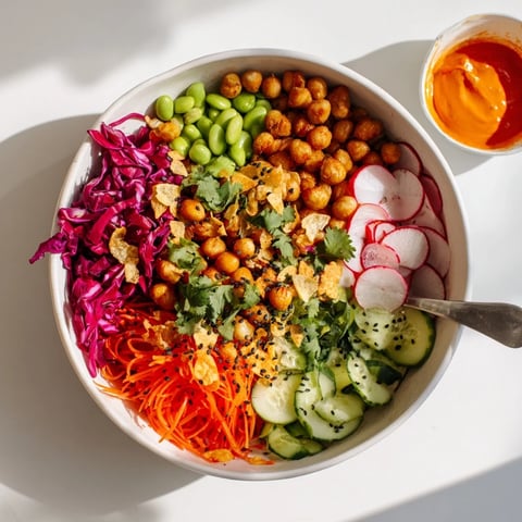 A colorful ASMR Crunch Snack Bowl overflowing with vibrant vegetables and crispy toppings.  
