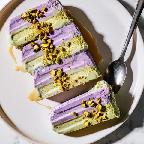 Creamy ube and pistachio ice cream bars ready to cool in summer heat.  