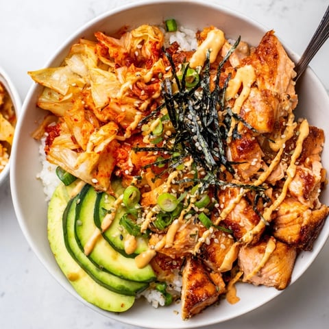 Crispy Salmon Rice Bowl topped with crunchy garlic, creamy avocado, and spicy mayo.