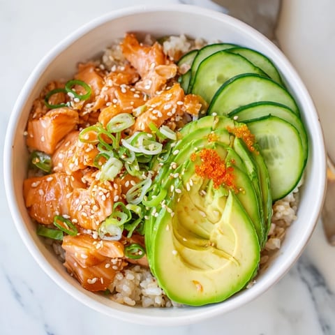 Flaky leftover salmon & rice bowl, steamed with ice, topped with fresh avocado.  