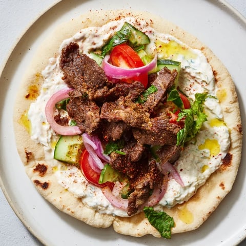 Savory Beef Shawarma Wraps filled with spiced meat, fresh veggies, and creamy yogurt sauce.
