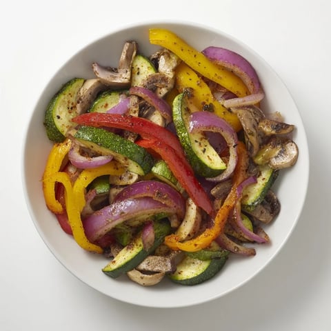 Vegetable fajitas sizzling in a skillet, bursting with colorful peppers and onions, ready to be enjoyed.