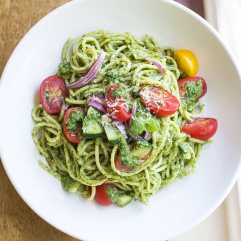Caesar Pesto Ditalini Salad with vibrant tomatoes and fresh Parmesan, ready to serve and enjoy.