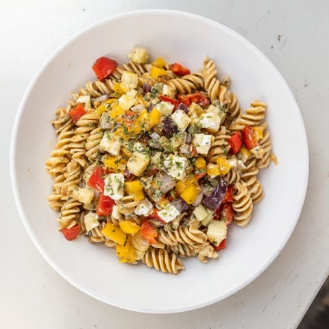 A close-up of Dill Pickle Chopped Pasta Salad, loaded with vibrant fresh vegetables and creamy dressing.