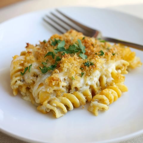 Golden-brown Lightened Mac & Cheese Snowflake Pasta Bake with a bubbly cheese sauce and crumb topping.