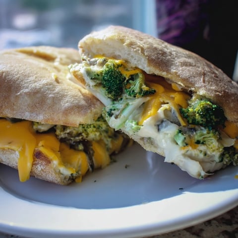 Golden-brown Air Fryer Broccoli Cheddar Stuffed Grilled Cheese, oozing cheesy goodness, ready to eat.