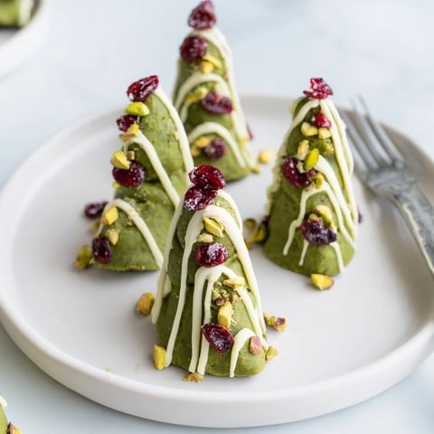 Bright green Matcha Pistachio Christmas Tree Energy Bites, a vibrant and healthy holiday treat, ready to eat.