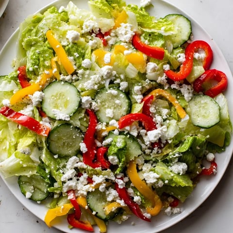 Vibrant Bella Hadid Salad with colorful bell peppers, crisp lettuce, and creamy feta cheese, ready to enjoy.