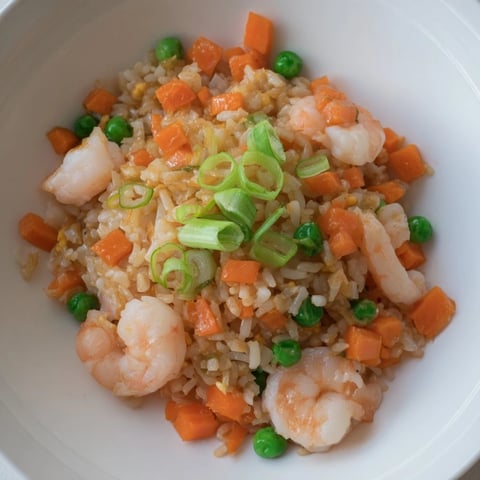 Golden, fluffy shrimp garlic fried rice with tender shrimp and vibrant vegetables, ready to eat!