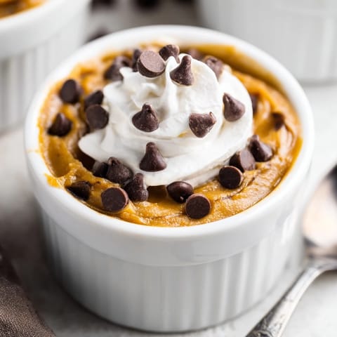 Indulge in the delicious Thanksgiving Chocolate Chip Pumpkin Pudding, smooth and spiced.  