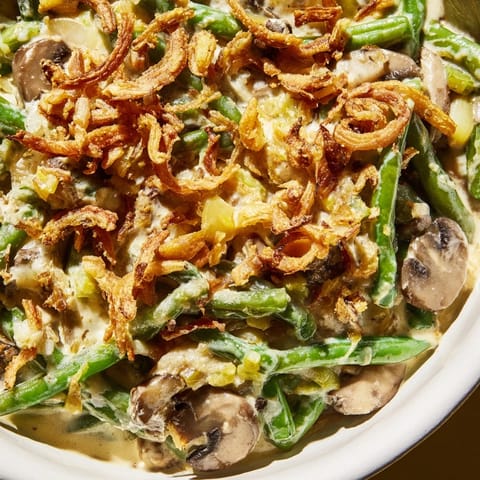 Creamy Old-School Green Bean Casserole topped with crispy fried onions for a holiday feast.  