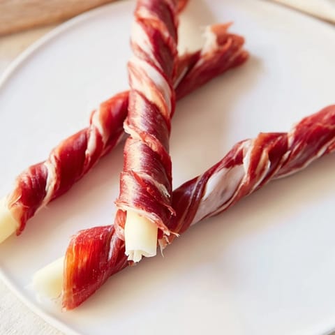 Enjoy the visually stunning Nautical Knot: A delicious braid of prosciutto and cheese, perfect for snacking.