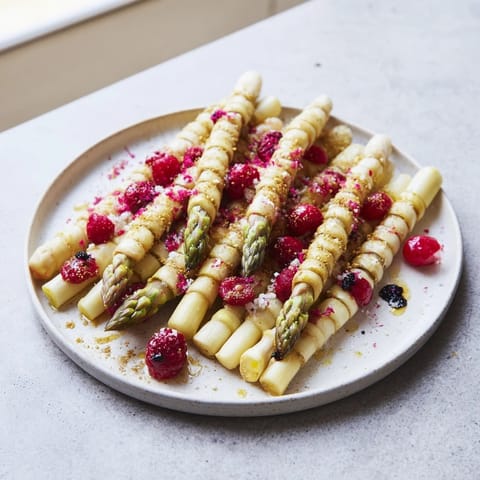 A beautiful overhead shot shows the delicious Botanical Lattice, a gourmet bite with fresh berries and asparagus.