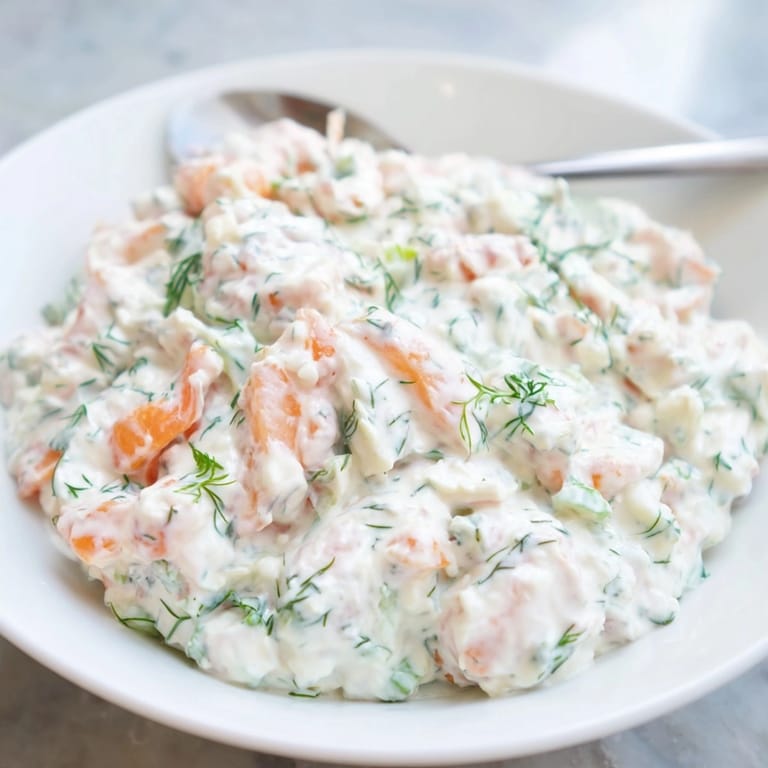 Close-up of homemade Shrimp Dill Yogurt Dip showing texture and fresh garnishes, delicious and gluten-free.
