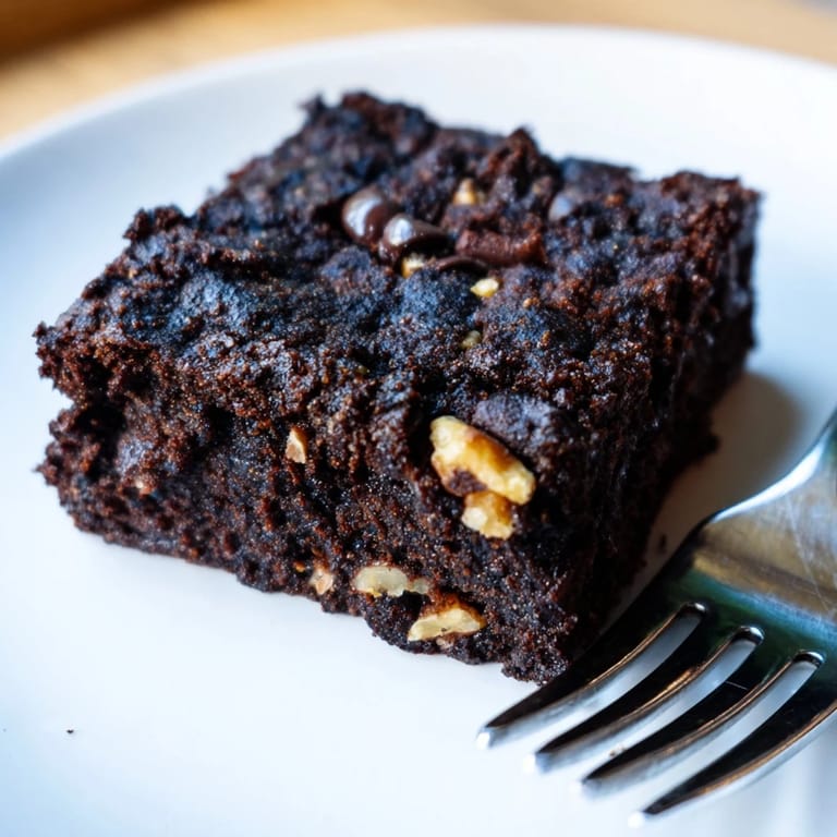 Delicious Zero-Waste Brownies topped with chocolate chips, ideal for dessert lovers.