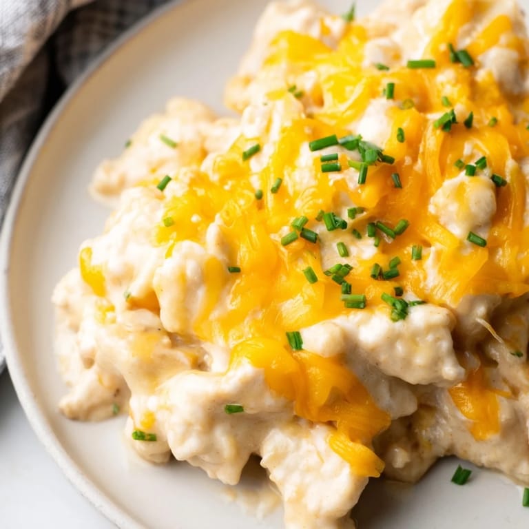 Comforting Cheddar Ranch Chicken Bake ready to serve alongside green salad.  