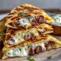Golden quesadillas stuffed with savory shepherds pie filling, mashed potatoes, and melted cheddar.